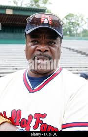 Rickey Henderson (24) of the New York Yankees gets back to second as a  pick-off throw by Milwaukee Brewers pitcher Don August and gets away from  second baseman Jim Gantner in the