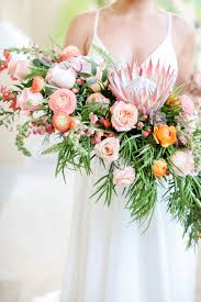 Handmade roses in peachy shades of coral & champagne. Tropical Inspired Garden Crescent Style Wedding Bouquet With Pink King Protea Peach White And Orange Florals With Greenery Tampa Bay Wedding Photographer Lifelong Photography Studios Marry Me Tampa Bay Most