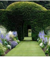 Indeed, no cottage garden will be the same two years in a row. Yew Hedging Arches Formal Garden Design Beautiful Gardens Cottage Garden