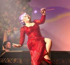 She also carries around a wand. In The Turkish Verison Of Shrek 2 The Song That Fairy Godmother Sings I Need A Hero Is The Turkish Song Written By A Famous Singer That Came Out 1 Year After
