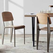 Made of superior metal and thick wood seat and with a simple and modern appearance, these the side chairs with the wooden seat are polished in black color. Black Standard Metal Dining Chair Modern Furniture
