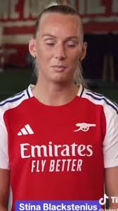 Katie Sneezing in Front of A Football Team