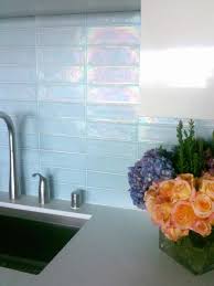 It's always fun when something added for utility — in this case, to protect kitchen walls from water and worse — is used as an excuse to add. Kitchen Update Add A Glass Tile Backsplash Hgtv