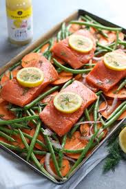 One Pan Salmon And Veggie Bake The Real Food Dietitians Recipe Baked Veggies Real Food Recipes Whole30 Salmon Recipes
