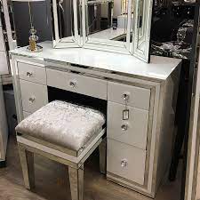 The large mirror that traditionally tops a dressing table is a key. Madison White Glass 7 Drawer Mirrored Dressing Table Picture Perfect Home