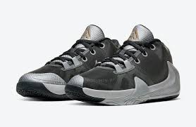 One of which is a white sneaker with red soles and logos. Nike Zoom Freak 1 Gs Smoke Grey Metallic Silver Metallic Gold Bq5633 050 Release Date Sbd