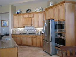 Maple Cabinetry Travertine Floors And Backsplash Quartz Countertops Maple Kitchen Cabinets Maple Kitchen Elegant Kitchens