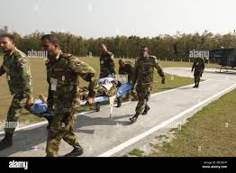 Bangladesh Army Soldiers practice unloading a simulated casualty from a  helicopter as part of a simulated mass casualty training event as part of  Exercise Shanti Doot 4 in Bangladesh. Shanti Doot 4