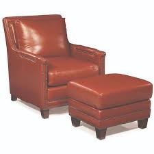 The ottoman also features metal tufting and rests on caster feet. Red Leather Chair And Ottoman