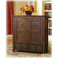 Browse online or visit a local store today! T553 20 Ashley Furniture Mckenna Door Accent Cabinet Brn Metal