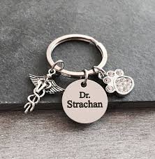 If you're looking for a small but significant gift to give to someone who's just graduated or is already in the field, this veterinarian's keyring will make a very touching idea. Pin On Jewelry Keychains And Bag Charms