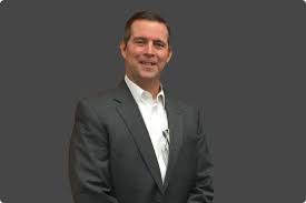 A Background On ... Adrian O. Breen