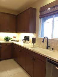 Mint green cabinetry and white quartz countertops is a charming kitchen combination, especially when paired with open shelving, brass hardware, and vintage décor. Dark Kitchen Cabinets W Light Quartz Countertop Undermount Cast Iron Sink Dark Kitchen Dark Kitchen Cabinets Kitchen