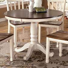 Choose the dining room table design that defines your family's style and character. Signature Design By Ashley Whitesburg Two Tone Round Table With Pedestal Base Royal Furniture Kitchen Tables