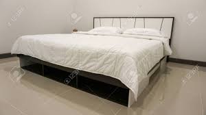 Find the perfect home furnishings at hayneedle, where you can buy online while you explore our bedroom designs and curated looks for tips, ideas & inspiration to help you along the way. King Size Or Queen Size Bed With Covers Duvet And Pillows Decorated Stock Photo Picture And Royalty Free Image Image 149534996