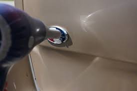 Using a heat gun to remove a car emblem step 1: Removing Dealership Emblems Zen Auto Detailing