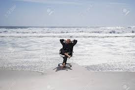 Browse swivel desk chair designs online. Senior Business Man Sitting On Office Chair On Beach Elevated Stock Photo Picture And Royalty Free Image Image 18898734