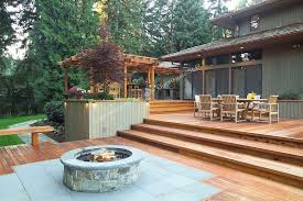 The height of the stone should be about 1 foot above the. A Deck Made For Outdoor Entertaining Homeandgardenphotos Com Backyard Deck Fire Pit Pergola Shade Diy