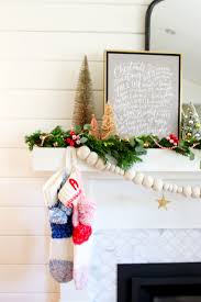 Hanging christmas ornaments on the tree is a classic activity for the whole family, fun for small children and adults alike. My Modern Holiday Mantel With A Vintage Twist Modern Glam