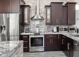 Dark cabinets don't have to be black—if the midnight mood isn't for you, consider a lighter shade of brown. Benefits Of Dark Kitchen Cabinetry Trends Wood Finishing