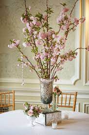 Wedding Centerpiece Idea Cherry Blossom Arrangements In Mercury Glass Vase Atop Mirrored Branch Centerpieces Wedding Wedding Centerpieces Cherry Blossom Vase