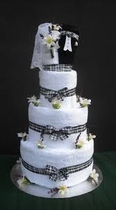 Make the base fold the large towels in half lengthwise and roll one of them loosely. 530 Cake Gifts Ideas Towel Cakes Gift Cake Towel Cake