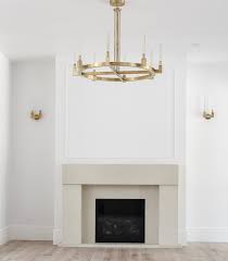 A modern, stone fireplace packs a punch in this sundrenched living room. The Forest Modern Living Room Featuring A Gorgeous Cast Stone Limestone Mantel The House Of Silver Lining
