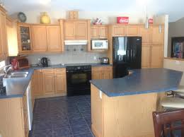Choose light colored kitchen tile floors with oak cabinets to look darker. Blue Floor Tile And Blond Kitchen Cabinets Work Arounds