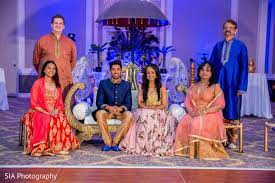 Cute Indian Bride And Groom With Family Portrait Indian Bride And Groom Indian Bride Wedding Photos Poses