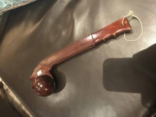 What is the unknown object that resembles a baton or a unique instrument?
