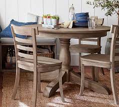Thinking about a round table for the eat in part of the kitchen.but that doesnt go with the sofa. Owen Round Pedestal Extending Dining Table Pottery Barn