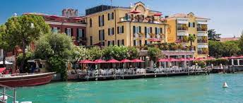 Discovered in 1889 the sulphurous thermal water and thermal mud of its spring containing bromide and iodide salts has since then been used for its preventive and. Terme E Grandi Alberghi Di Sirmione Scolaro Parasol Ombrelloni Da Giardino