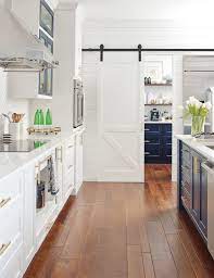 Being the storage areas for an assortment of kitchens resources such as silverware. Omega Cabinetry White Kitchen With Sliding Barn Door Transitional Kitchen Other By Masterbrand Cabinets Inc Houzz