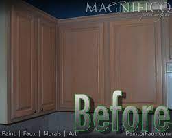 Neutrals and simple classic colours are a great way to update wood cabinets. Builder Grade Oak Cabinets With Pickled Oak Stain Before Cabinet Refinishing Yuck Kitchen Cabinets Cabinet Refinishing Cabinets