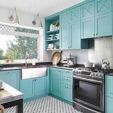 blue kitchen cabinets with black quartz