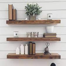 Reclaimed Floating Wood Shelves Thick Reclaimed Wood Floating Shelves In Front Of A Wh Floating Shelves Living Room Floating Shelves Kitchen Floating Shelves