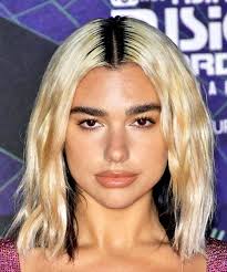 Half and half two tone hair. Dua Lipa Medium Wavy Black And Light Blonde Two Tone Hairstyle With Blunt Cut Bangs Visual Story