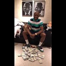 Big bottles for those big moments… Boxing Legend Floyd Mayweather Shows Off Huge Wads Of Cash After Private Fashion Store Shop