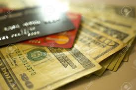 A credit card lets you borrow money from a bank or other lenders and use it for transactions and purchases without paying in cash. Money And Credit Card Stock Photo Picture And Royalty Free Image Image 64305807
