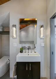 With wooden shelves and white ceramic toilet and wash basin. Photo 11 Of 13 In Renovated Houseboat A Unique Choice For Seattle Luxury Homebuilder Dwell