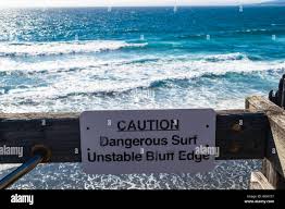Gualala, CA - August 3, 2019: A sign warning beachgoers of the deadly surf  conditions along the northern california coast Stock Photo - Alamy