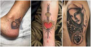 The heart is then topped with a crucifix. Updated 44 Sacred Heart Tattoo Designs August 2020