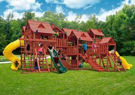 Choose a playground set that has appropriate equipment for your children, along with features they can grow into, such as monkey bars or a climbing rope. Gorilla Playsets Metropolis Wooden Play Set From Nj Swingsets Saved To Backyard Playground Play Backyard Playground Backyard Play Equipment Backyard Playset