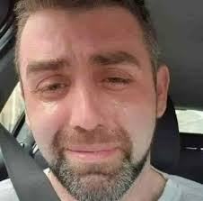 This is the final photograph of Phillip Herron 34, crying in his car,  literally minutes before taking his own life. He was a single Dad with  three kids, struggling with crushing debt