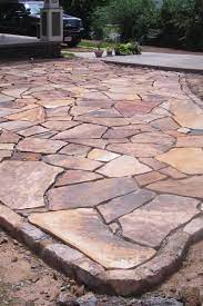 They eventually want to build the patio to end all patios, and this is their temporary and inexpensive option. 12 Easy Diy Stone Patio Projects You Can Do Yourself For Your Backyard Stone Patio Ideas Design No 1332 Patio Pavers Design Patio Stones Stone Patio Designs