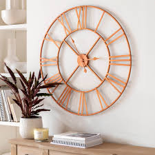 This modernist style white and gold metal wall clock is both simple and minimalist in terms of its design and appeal. Rose Gold Skeleton Clock Clock Homesdirect365