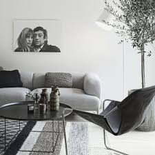 Scandinavian interior design is known for its minimalist color palettes, cozy accents, and striking modern furniture. Minimalist Nordic Interior With Shades Of Grey And Natural Wood