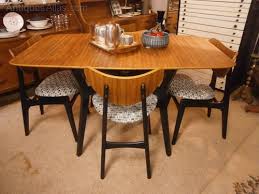 Antiques Atlas G Plan Librenza Drop Leaf Table 4 Butterfly Chairs A cocktail table that raises to dining table height serves both the living and dining rooms.