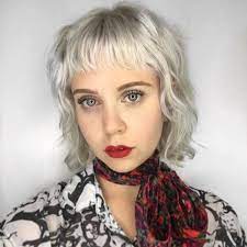 Icy Platinum Blonde Layered Bob With Messy Wavy Texture And Baby Fringe Womens Hairstyles Platinum Blonde Bobs Hair Advice