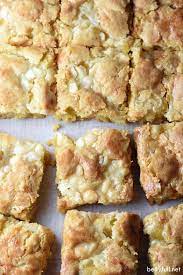 These Lemon Gooey Bars Get A Triple Dose Of Lemon From Lemon Cake Lemon Zest And Lemon Curd Moist Chewy Gooey Bars Lemon Recipes Cooking Recipes Desserts